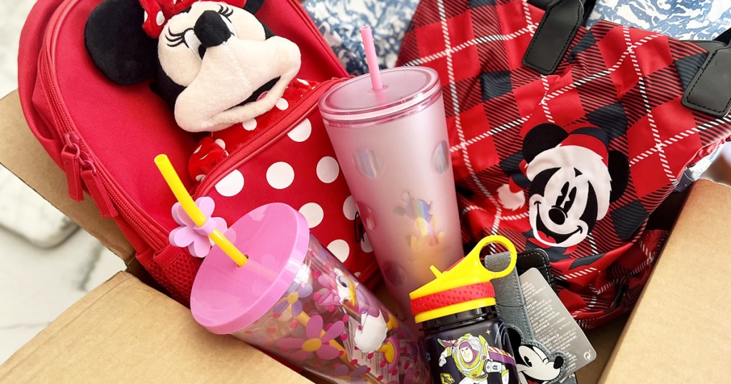 box full of disney tumblers and bags