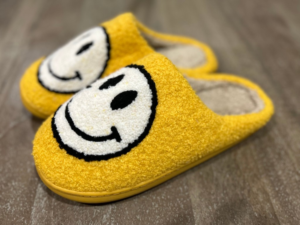 Smiley Slippers in yellow on tabletop