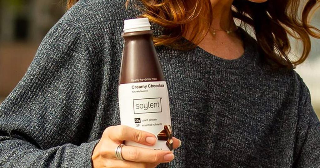 Soylent Creamy Chocolate Shake being held by a woman