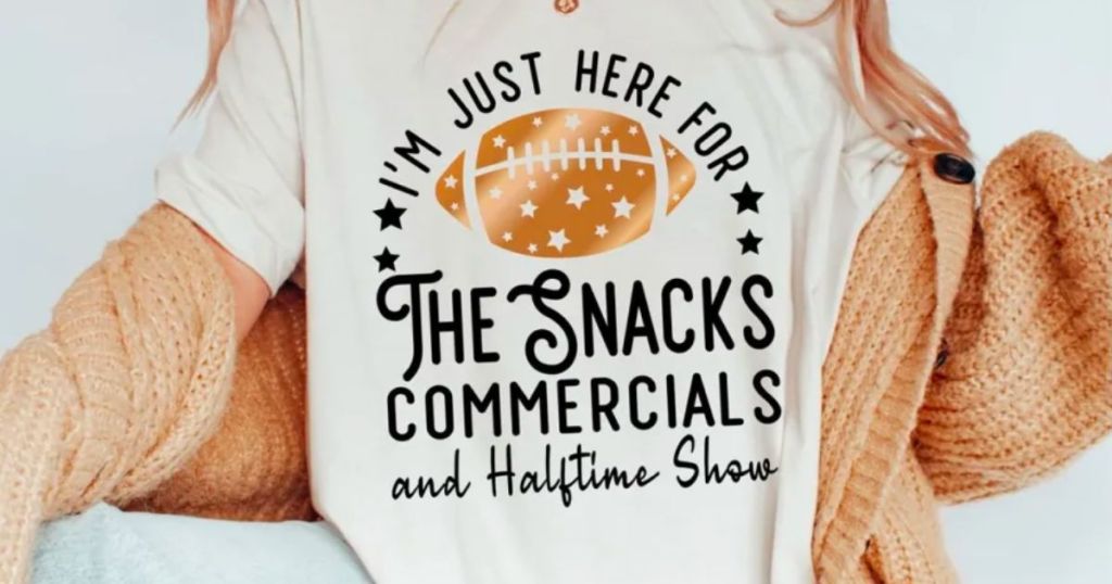 a woman wearing a Superbowl halftime show graphic tee from jane
