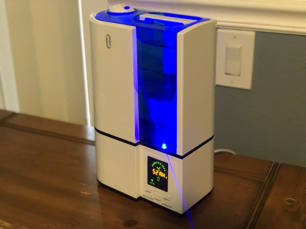 White humidifier with a blue light on the tank