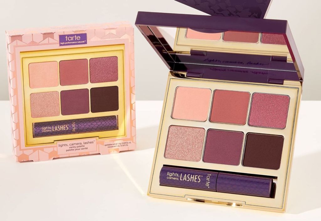 Tarte eyeshadow palette box next to an open eyeshadow palette with a mascara in it