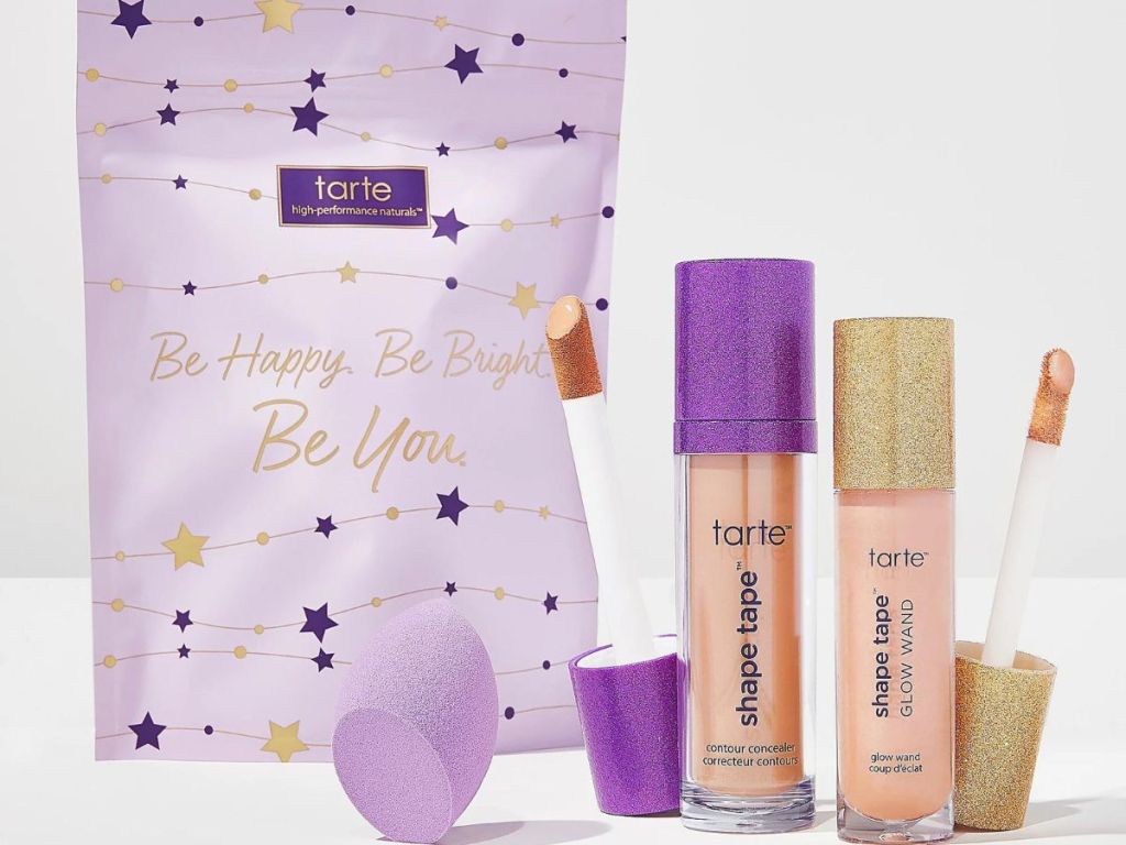 Two tubes of Tarte Shape tape and a sponge