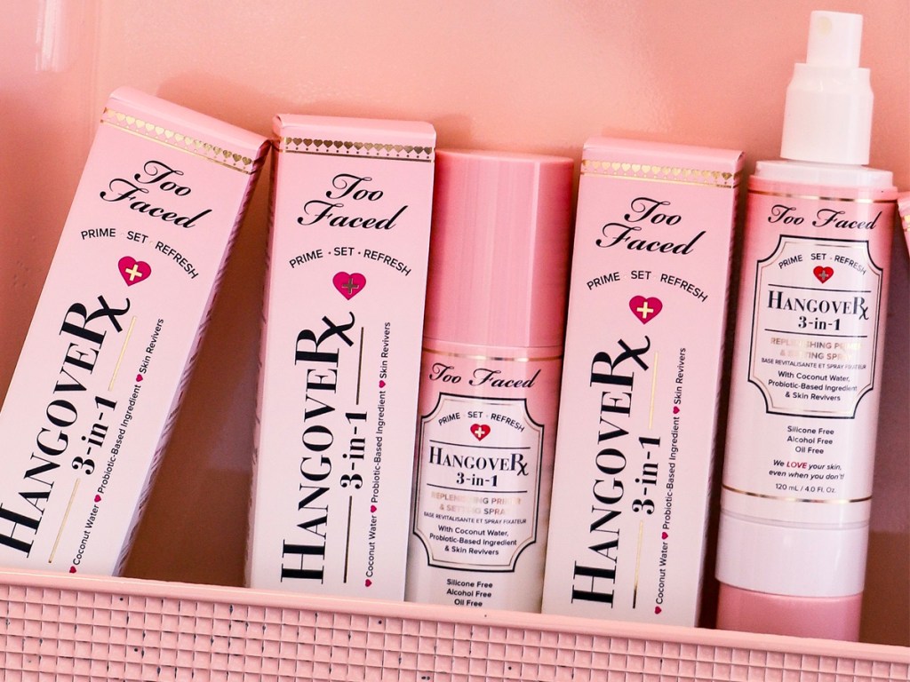 Too Faced Hangover Spray bottles and boxes in pink container