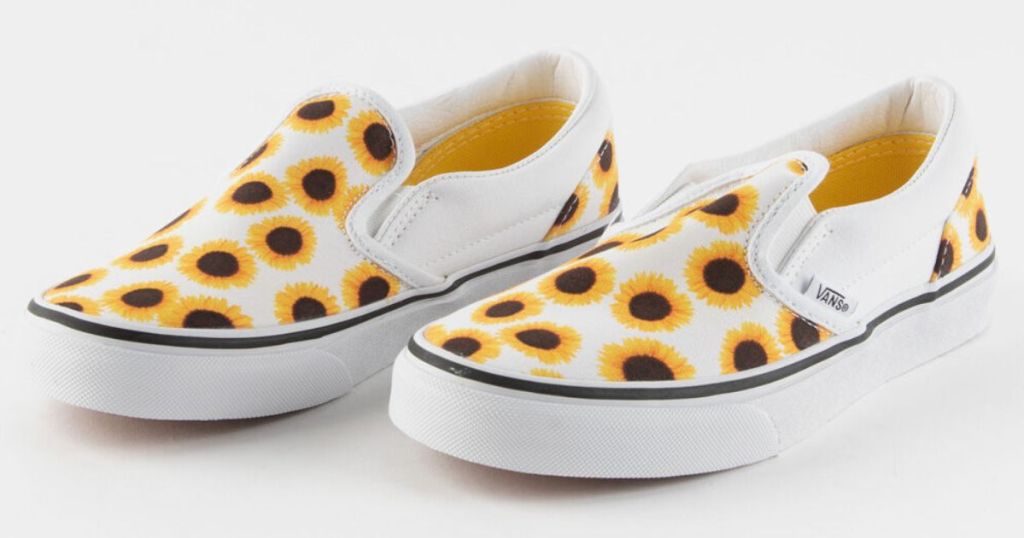 Pair of girls VANS shoes with sunflowers on a white background.