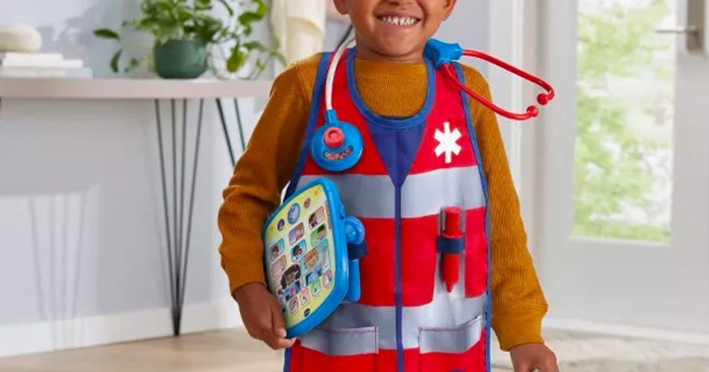 Little boy wearing pieces from the VTech First Responder Smart Rescue Set