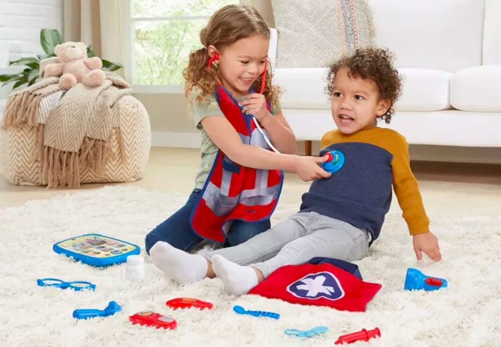 two children playing with the VTech First Responder Smart Rescue Set
