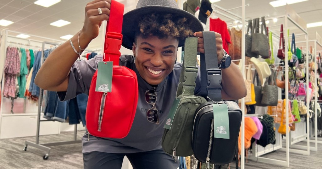 woman holding wild fable fanny packs from Target