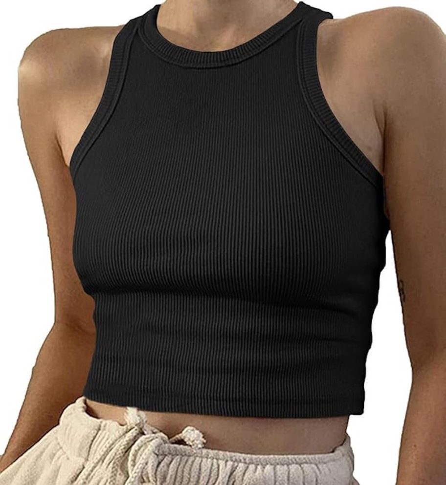 close up of woman wearing black ribbed tank