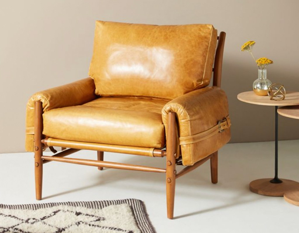 mustard colored leather accent chair in staged room 