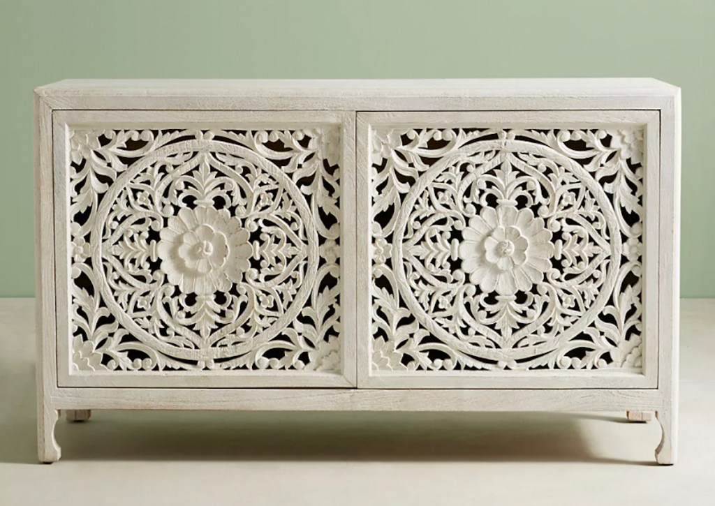 stock photo of white washed hand carved sideboard