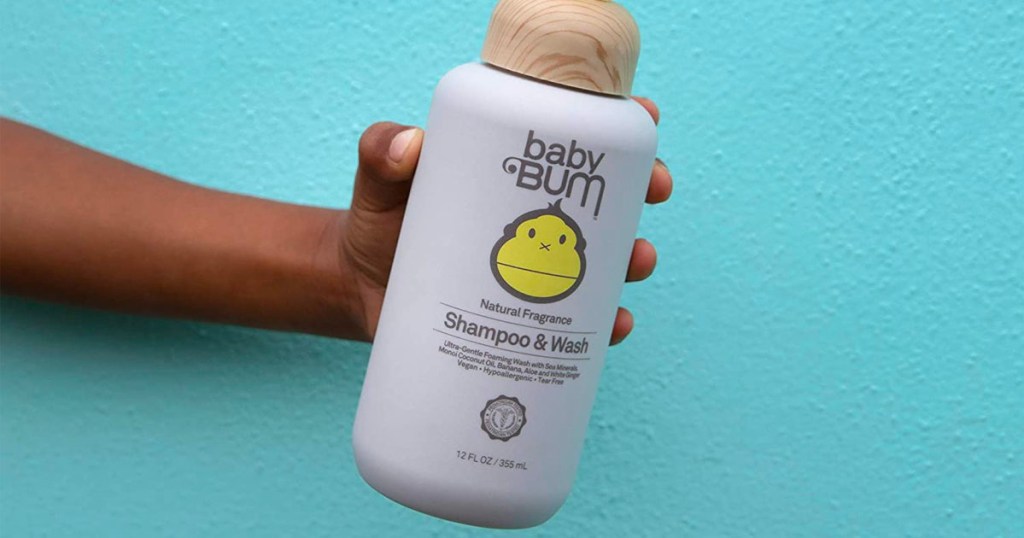 baby bum shampoo and wash in womans hand