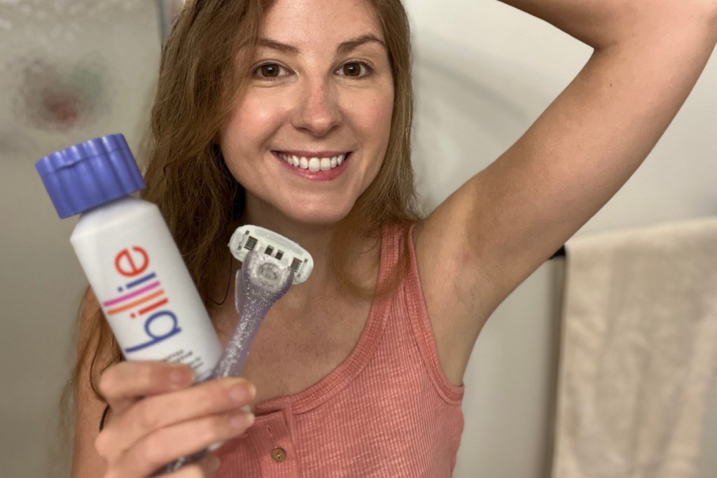 woman holding billie shaving products