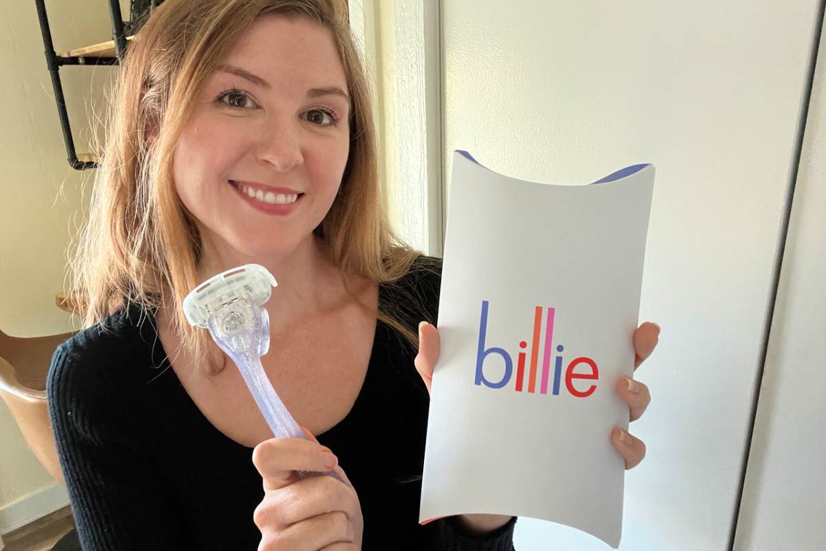 woman holding up a billie shaving kit