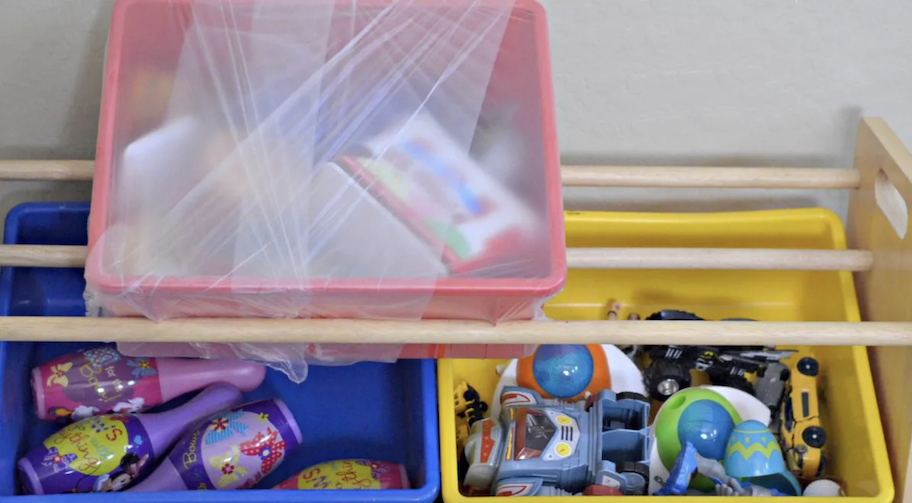 toy bins with plastic wrap for moving 