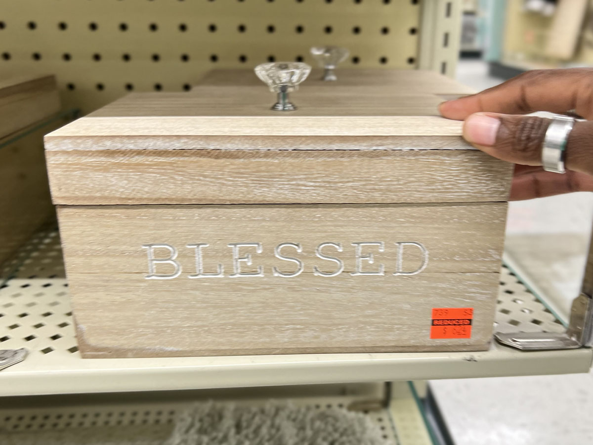 hand on blessed wooden box