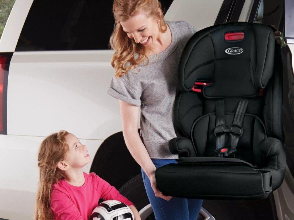 woman and girl with graco tranzitions car seat
