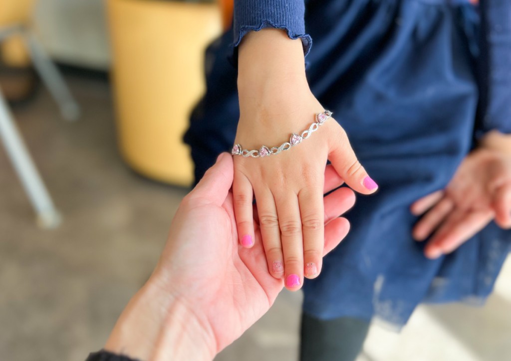 little girls hand with bracelet