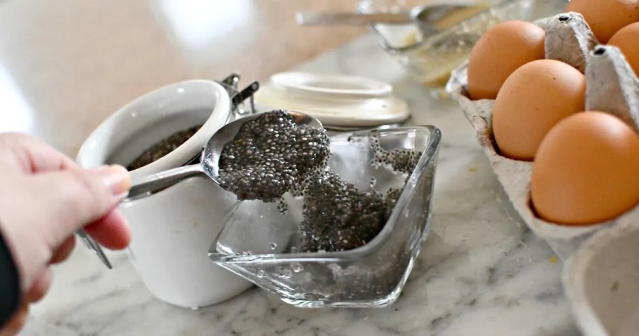 spoon scooping gooey chia seeds 