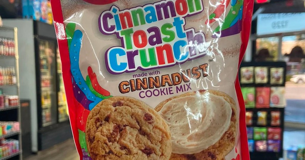 hand holding cinnamon toast crunch cookies bag in store