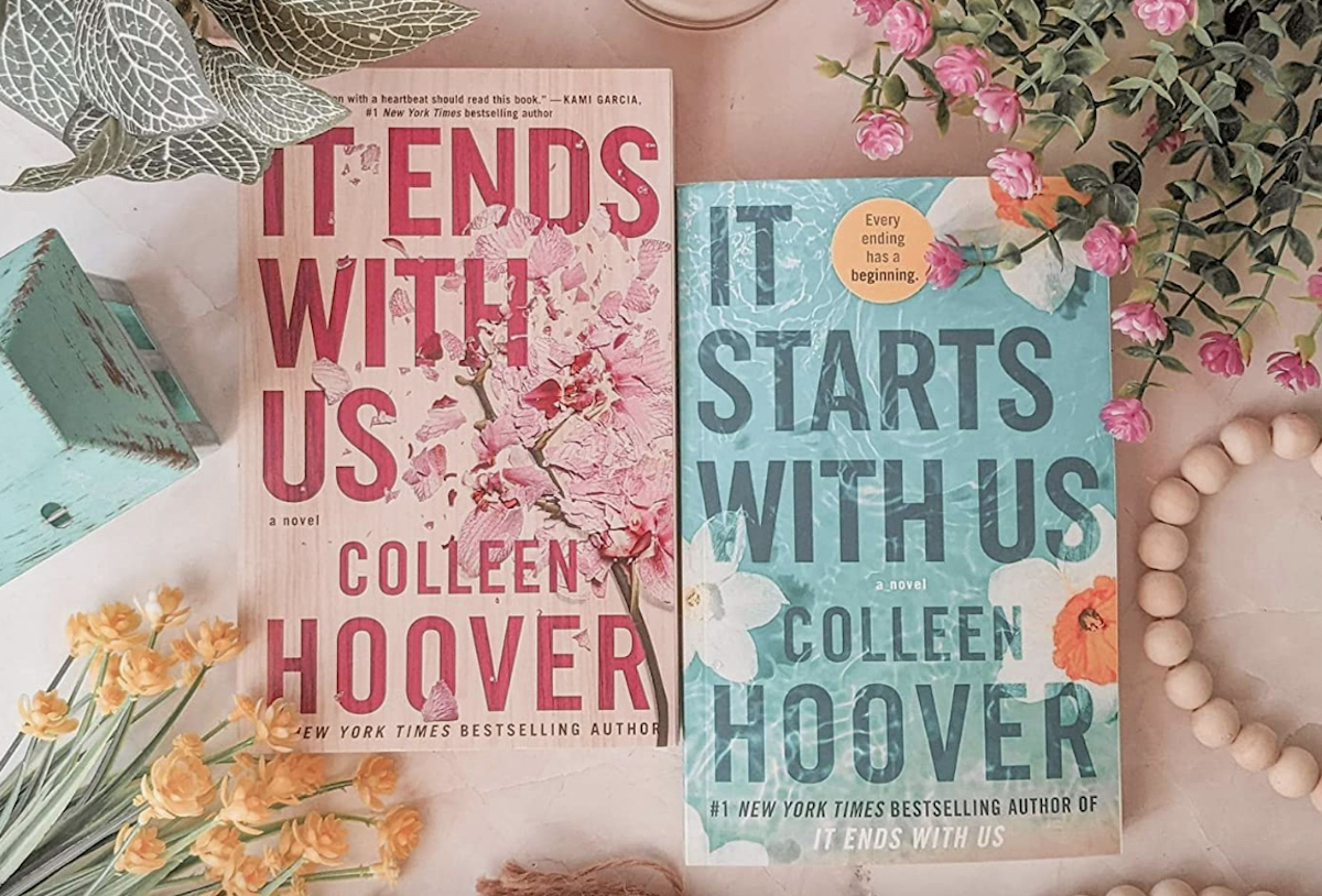 it starts with us and it ends with us book on table with other decor