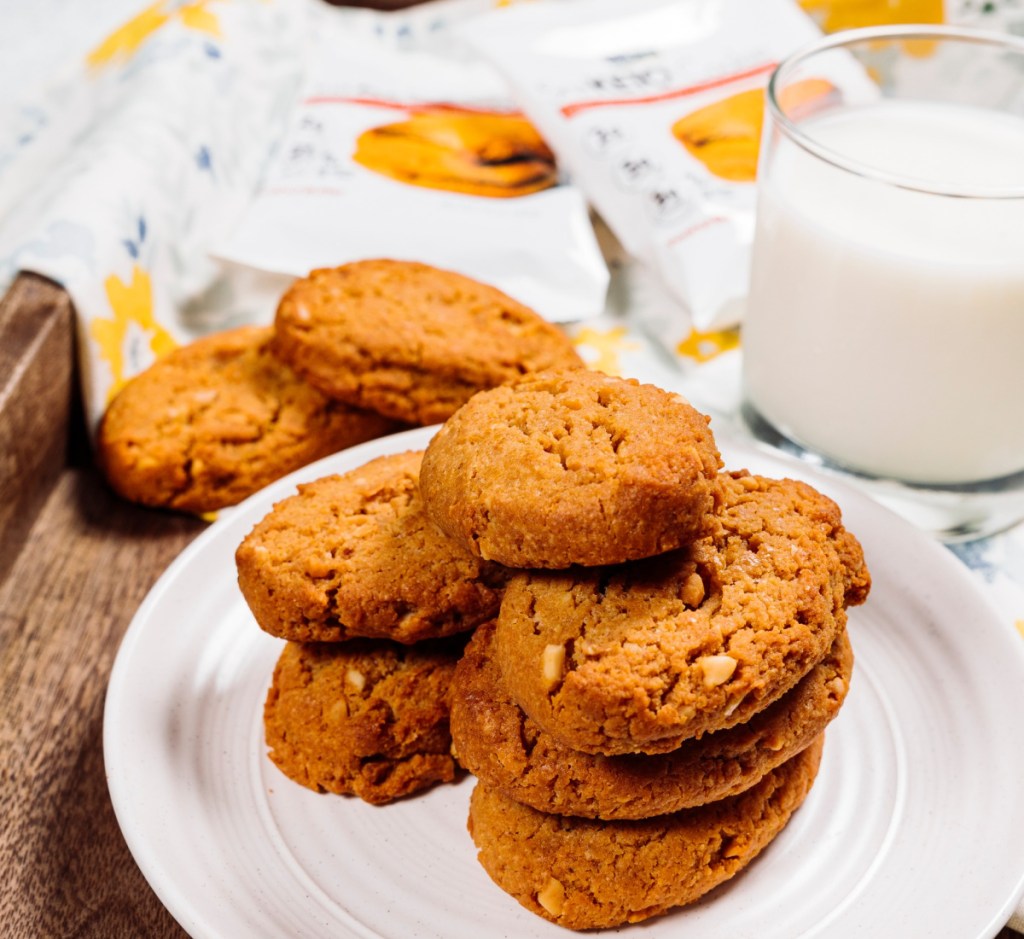 keto cookies on plate next to milk