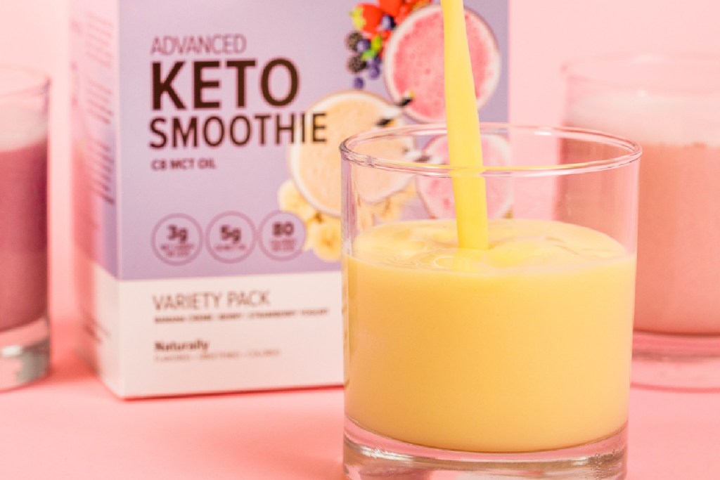 orange juice being poured in to glass