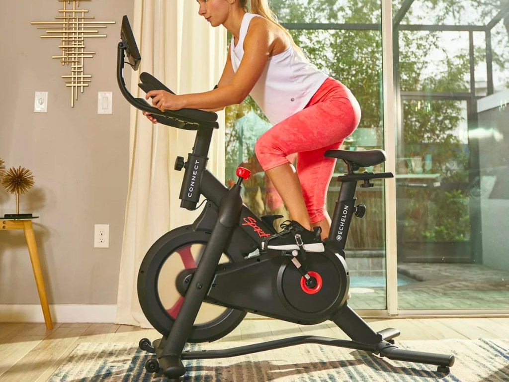 woman riding echelon indoor bike
