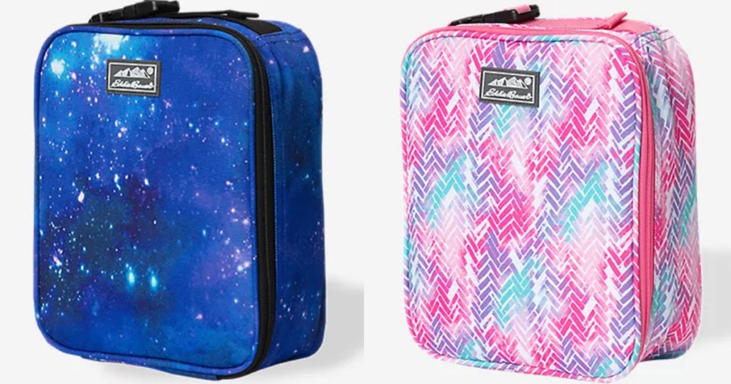 two lunchboxes blue galaxy and pink/purple stock images