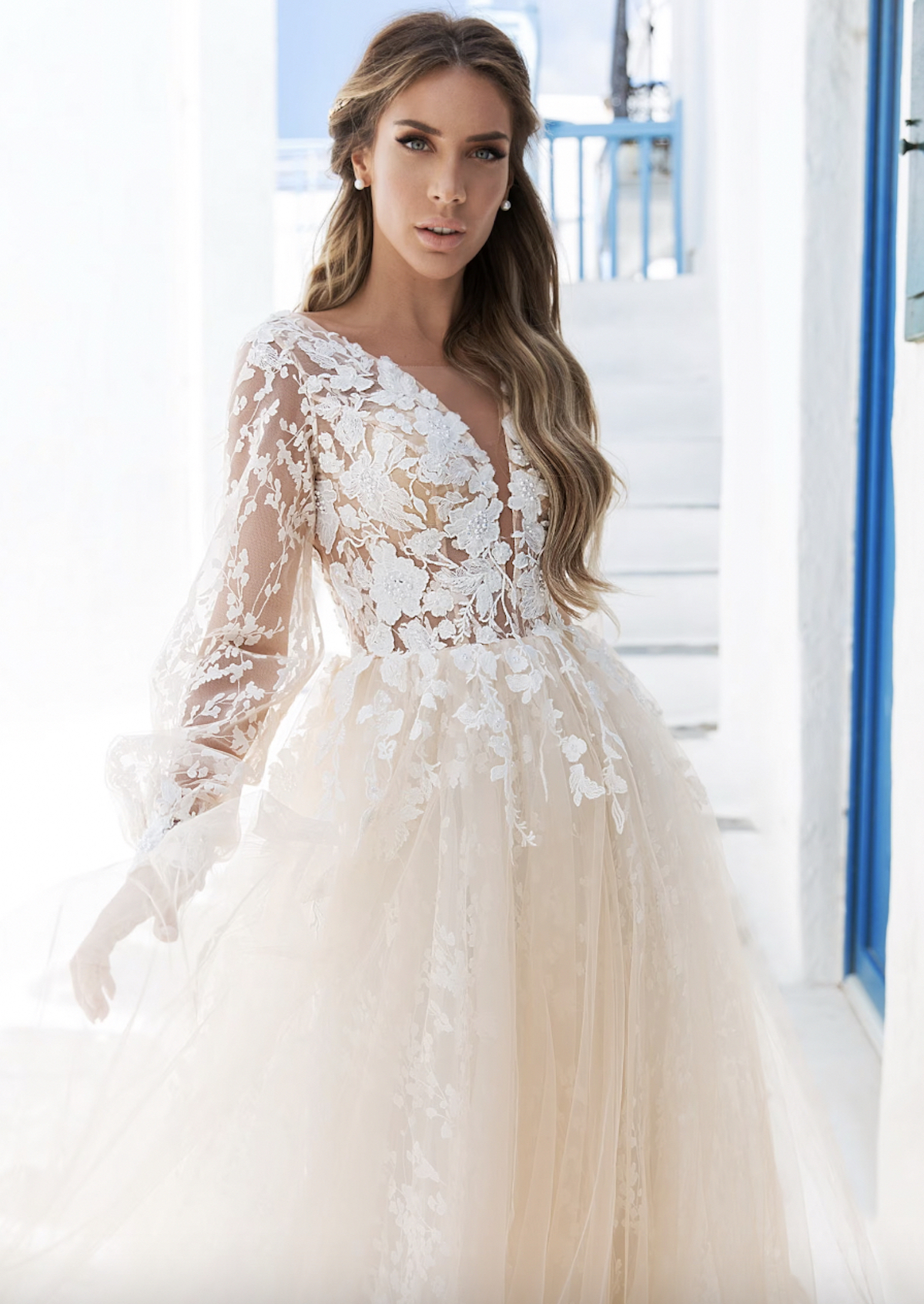 woman posing in lace boho wedding gown 