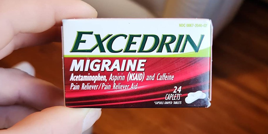 hand holding excedrin migraine box