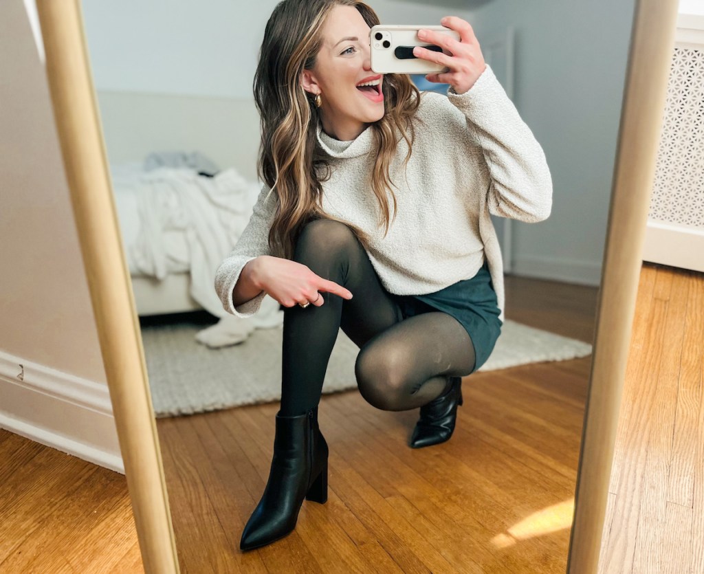 woman taking selfie in mirror wearing fleece lined tights