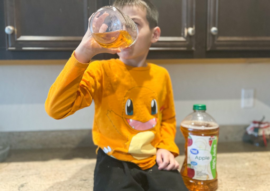 boy drinking apple juice