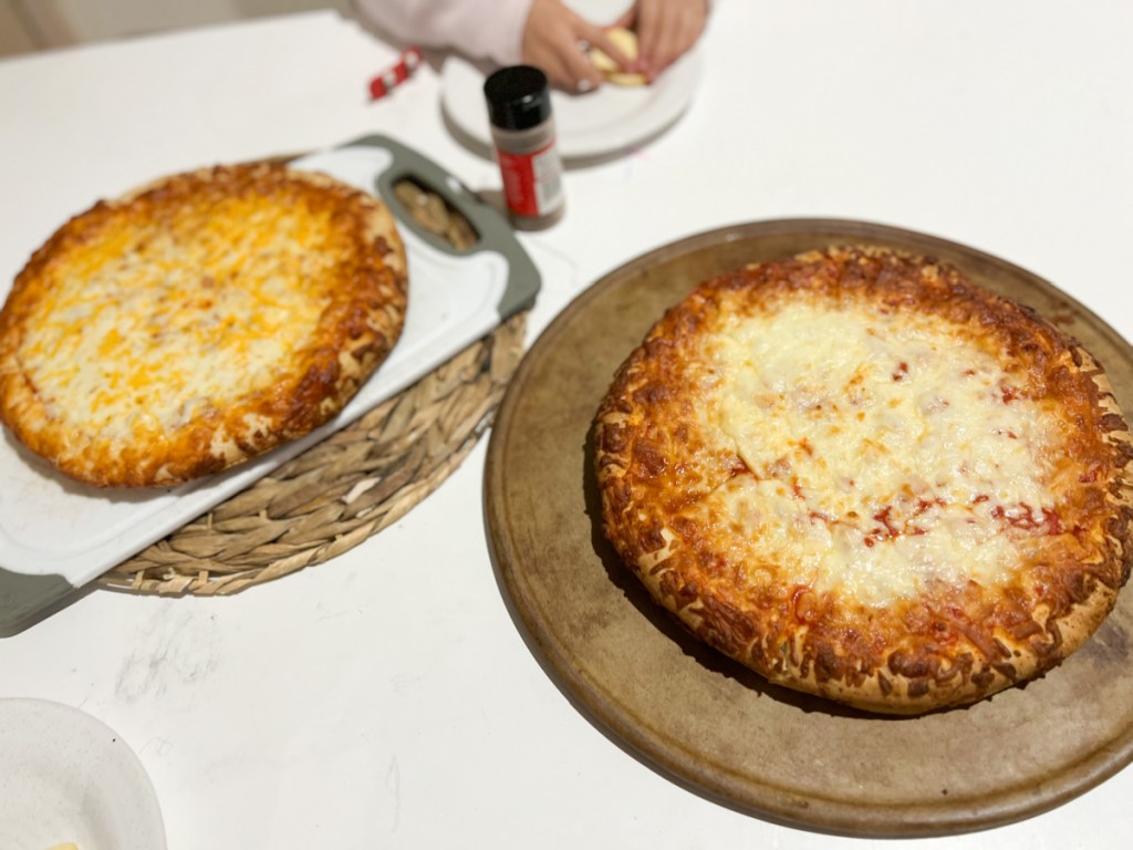 two cooked pizzas