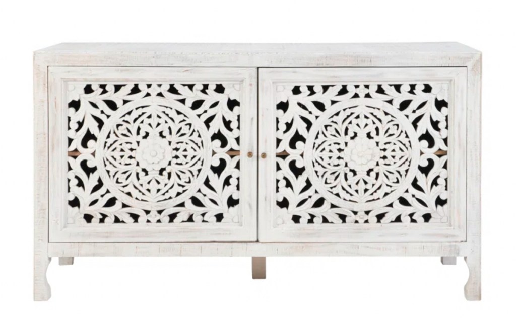 stock photo of white washed hand carved sideboard 