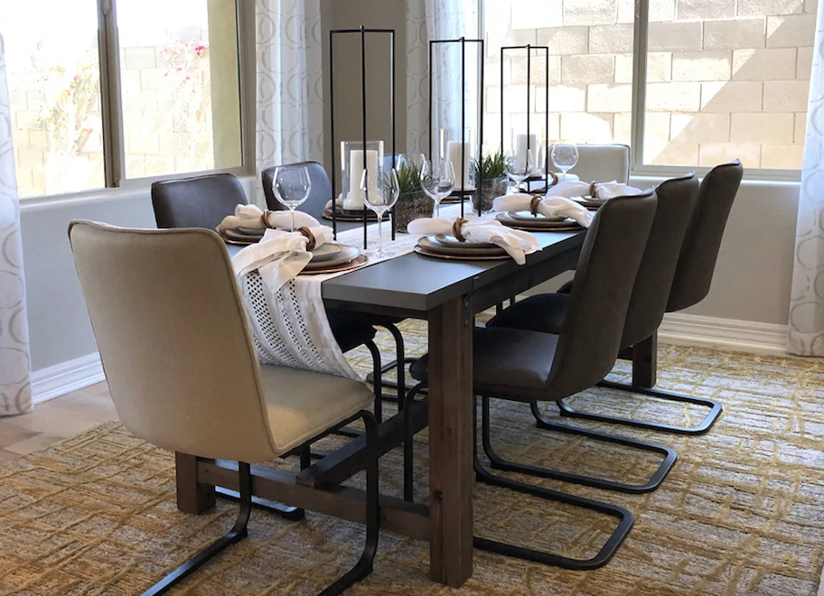 dining room tablescape with chairs and large windows