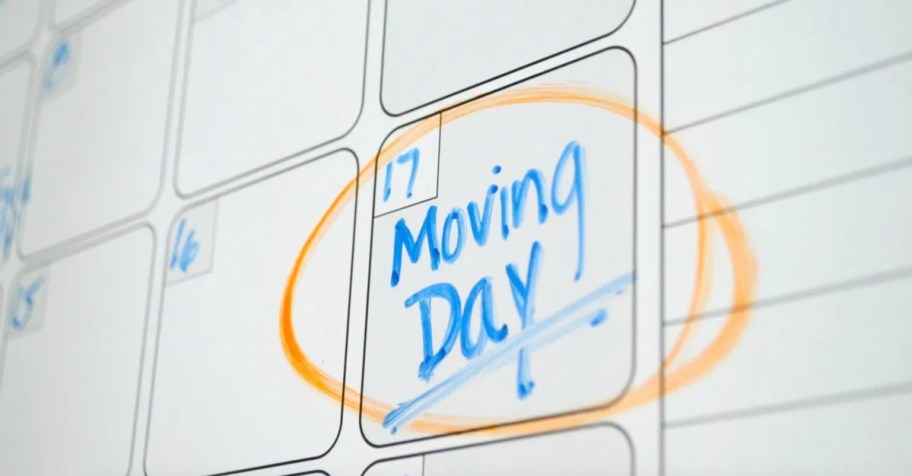 close up of moving day on whiteboard calendar