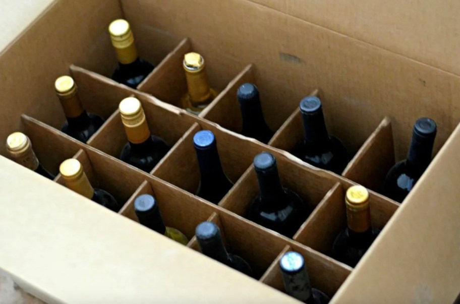 top view of organized wine box with various kinds of new wine bottles