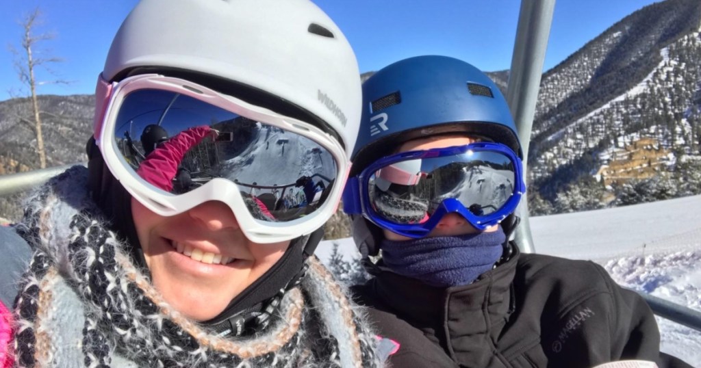 two skiiers wearing goggles