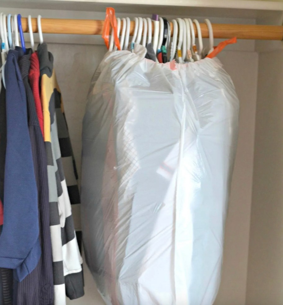 trash bag over hanging clothes in closet for tips for moving