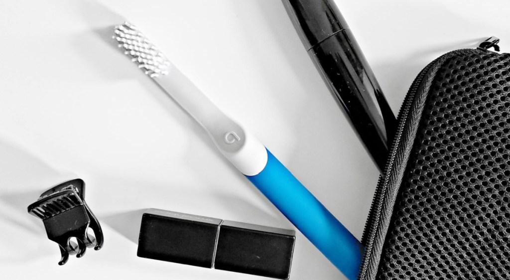 blue smart toothbrush in travel pouch