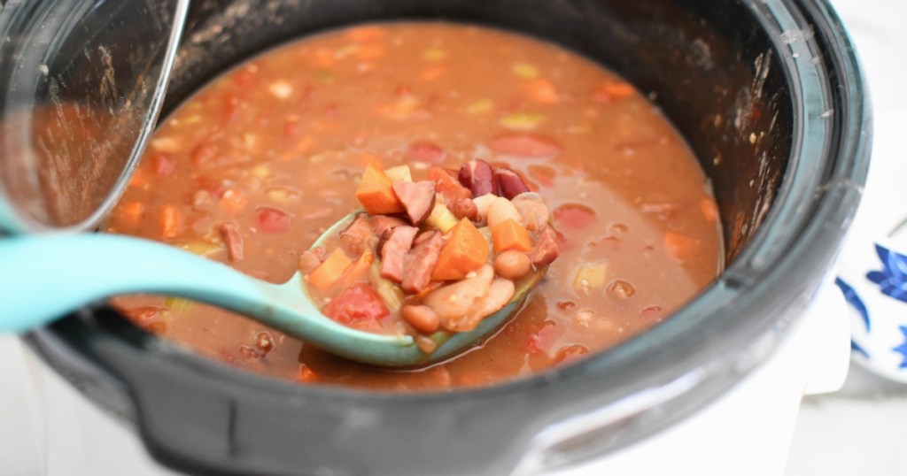 slow cooker with spoon of 15 bean soup