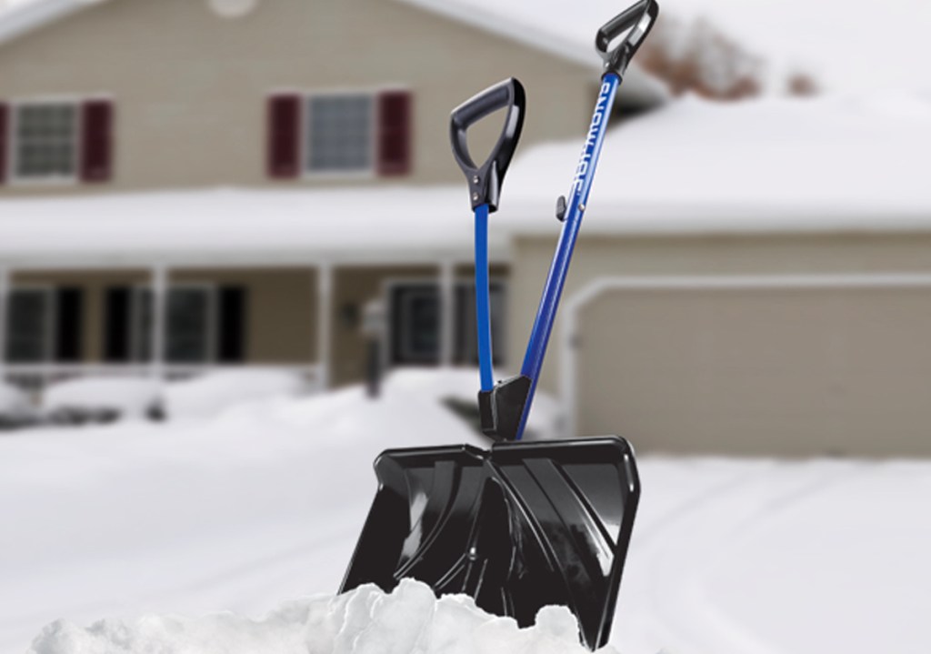 blue snow shovel in snow