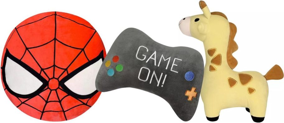 a spiderman face, game controller and giraffe squishy pillows