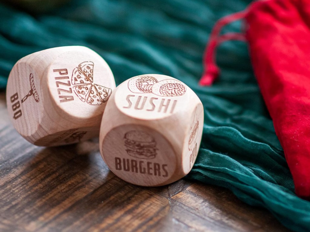 wooden takeout dice on green fabric