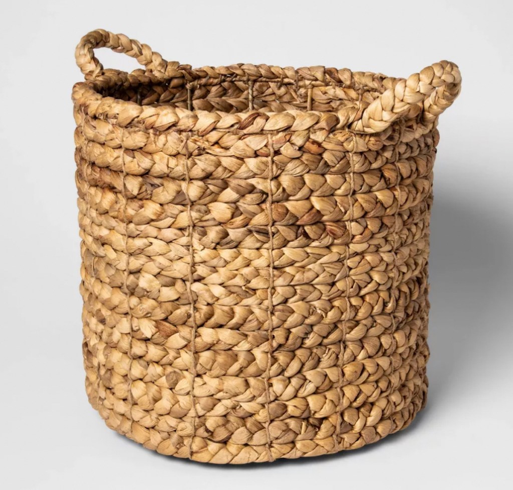 woven seagrass basket with gray background