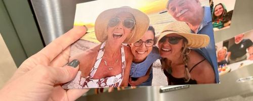 hand holding walgrens photo magnets