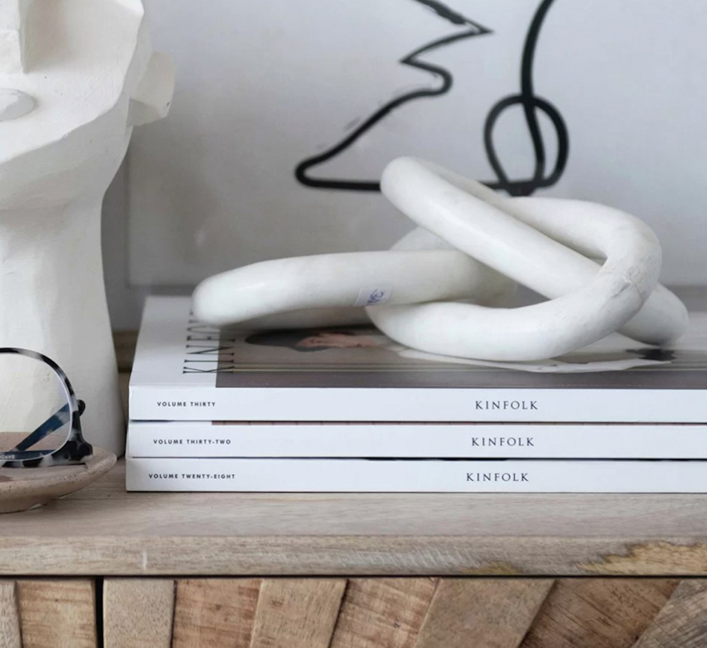 marble chain links on top of kinfolk magazines 