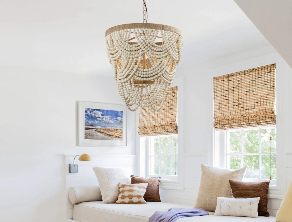 wood bead garland chandelier hanging from ceiling in nook space 