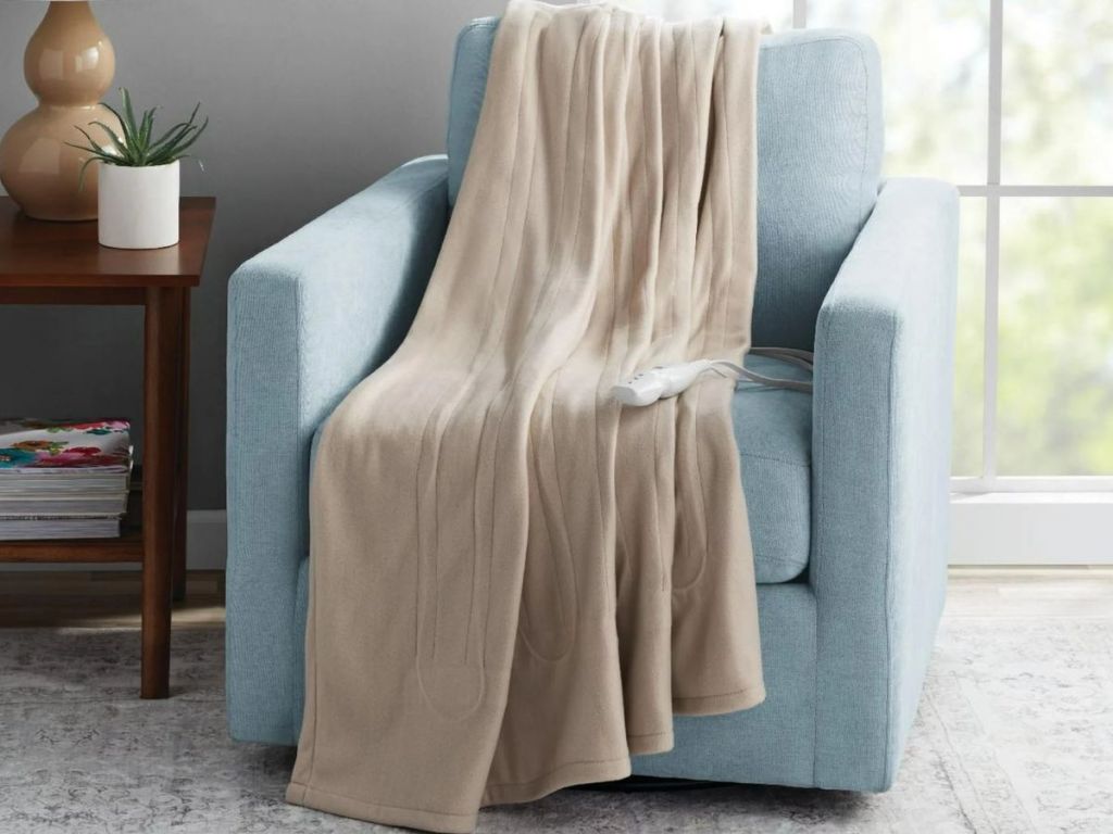 tan color electric throw over a chair